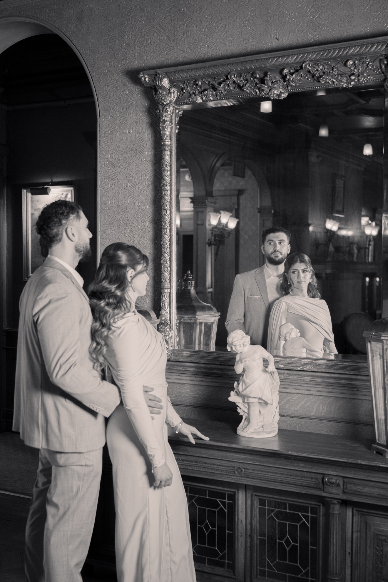 Black-and-white mirror portrait of Hussein and Selena