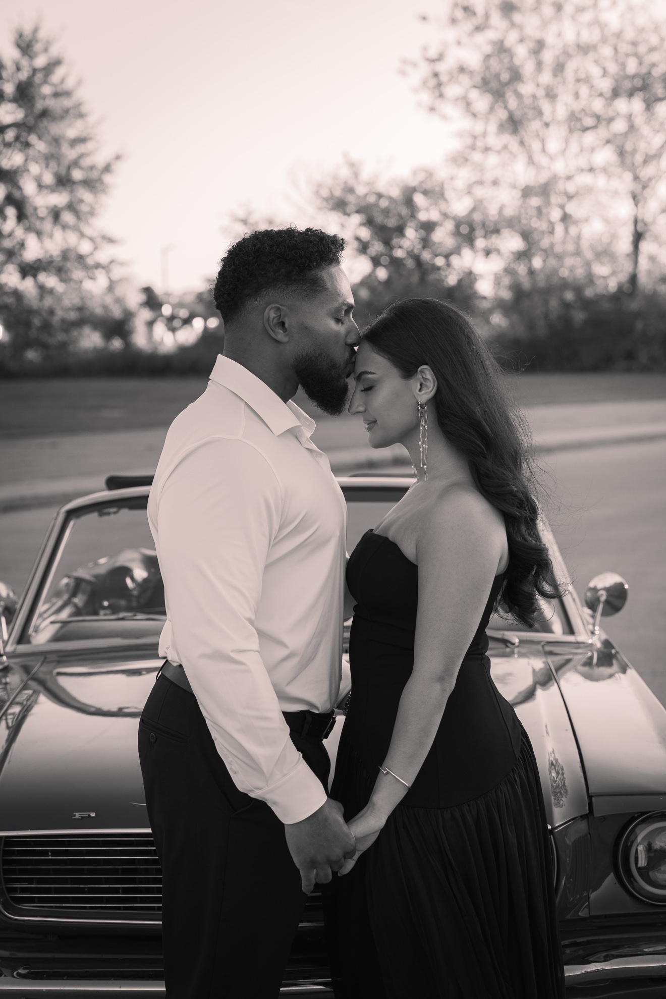 Hussien and Jamiley together beside a classic car