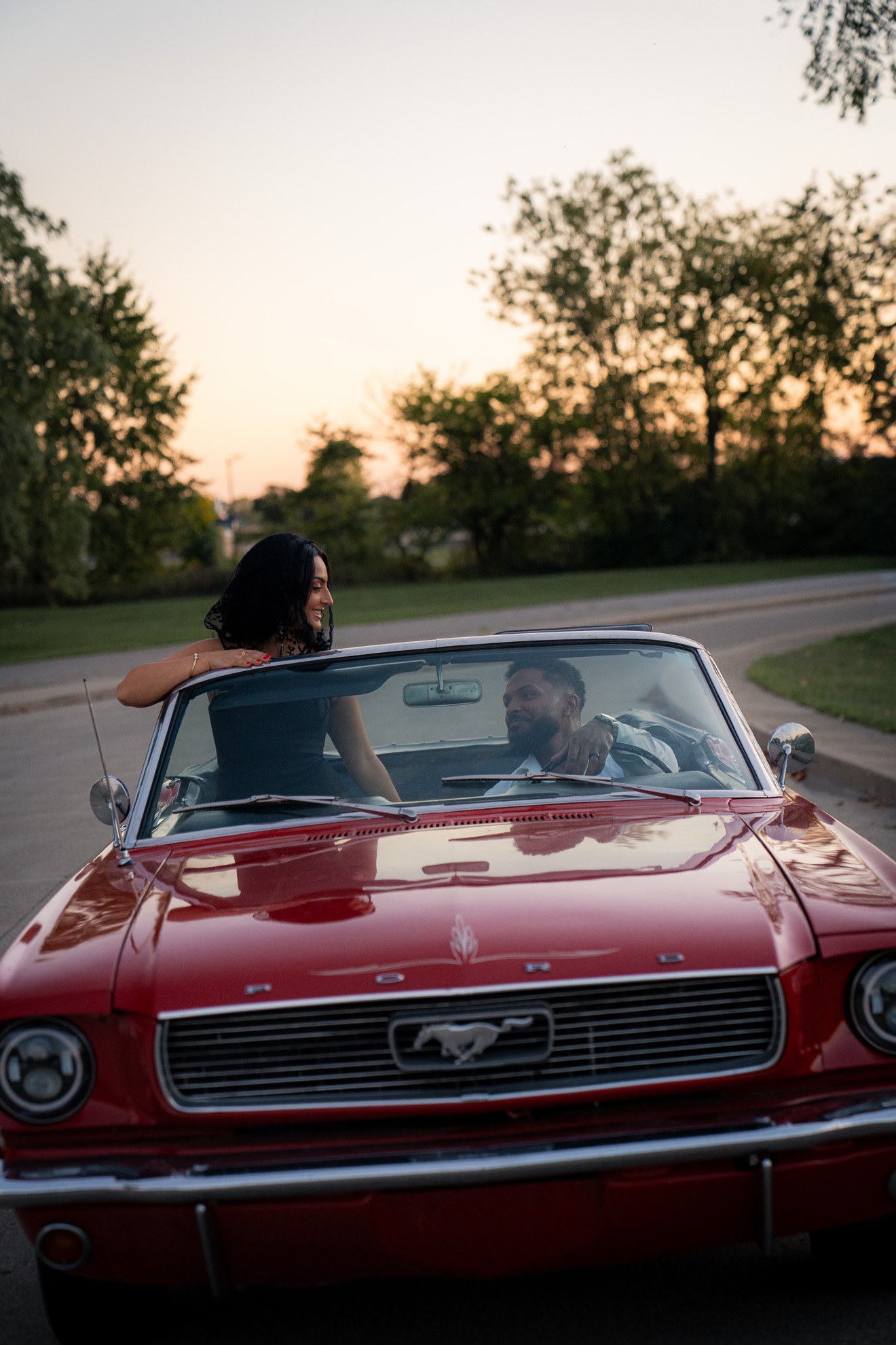 Portrait of Hussien and Jamiley beside a classic car