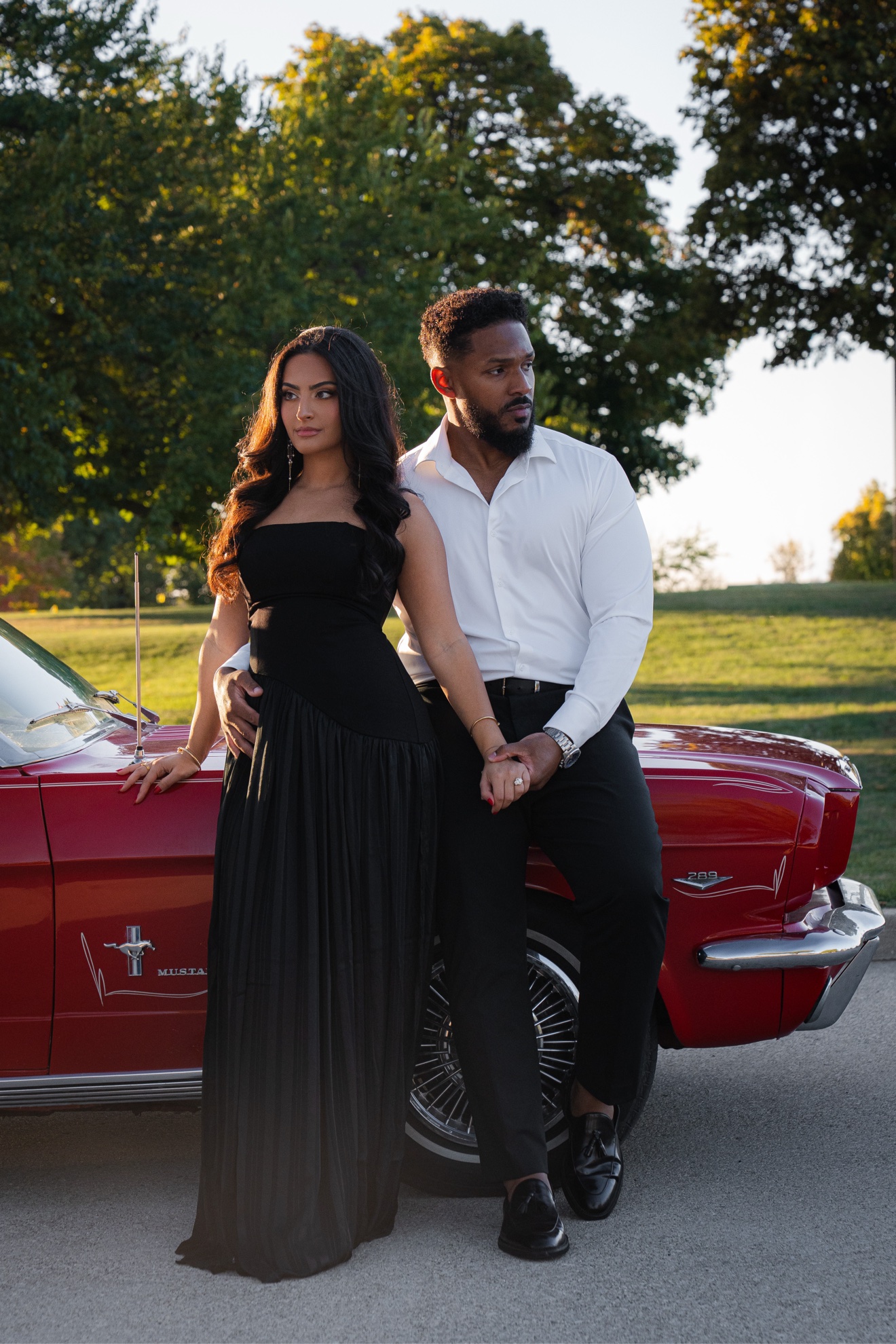 Hussien and Jamiley posed beside a classic car