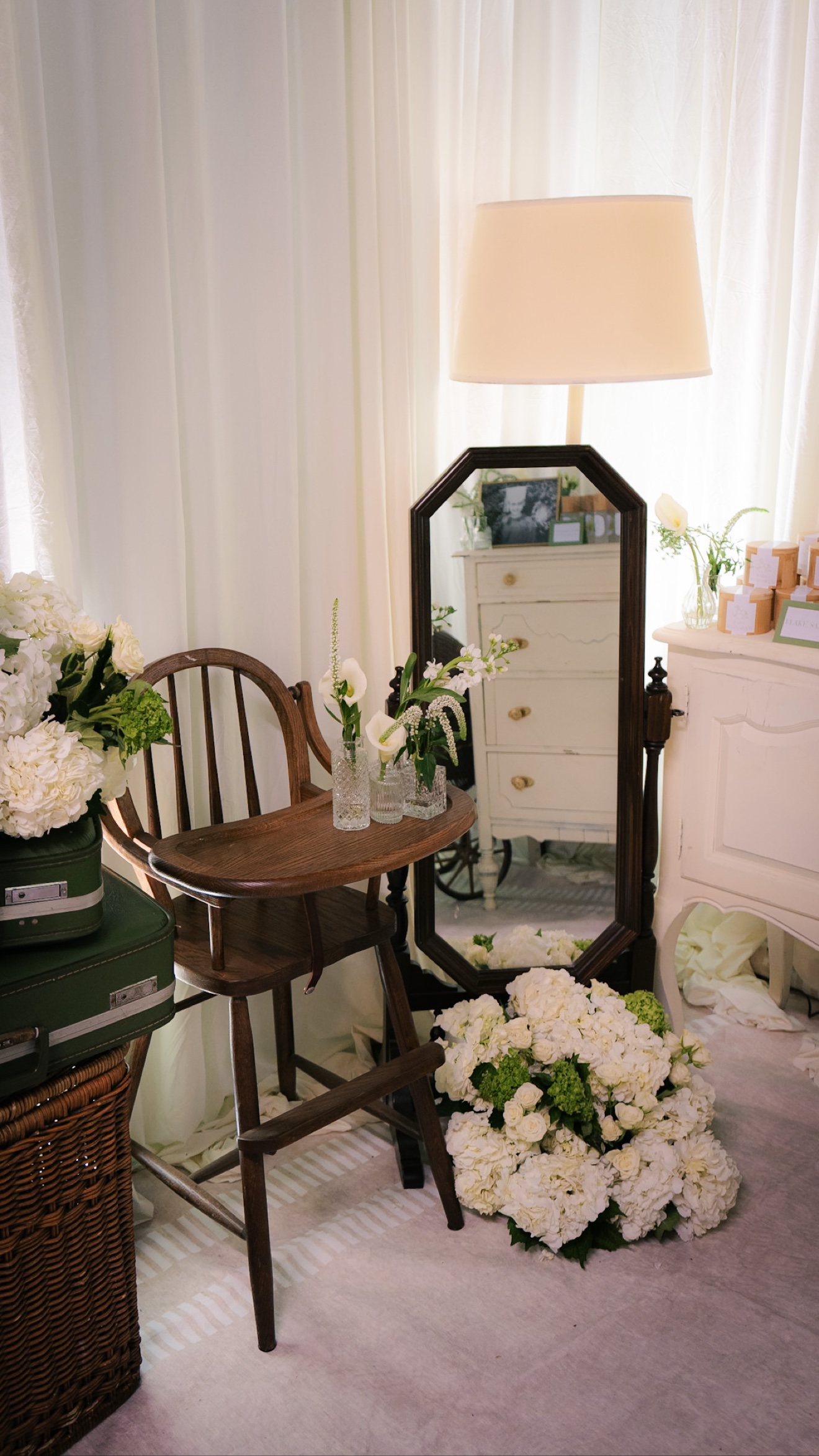 Vintage chair, mirror, flowers, and reception decor